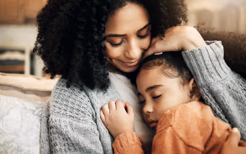 Mother and daughter cuddling